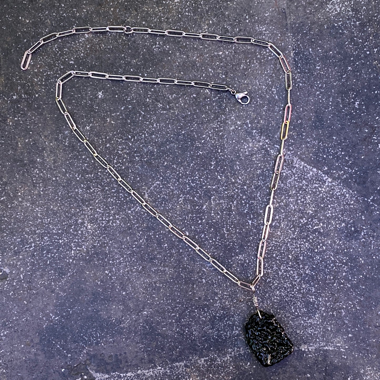 Moldavite Pendant on stainless steel chain necklace.