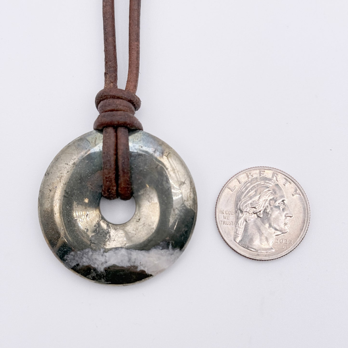 Pyrite donut necklace on leather