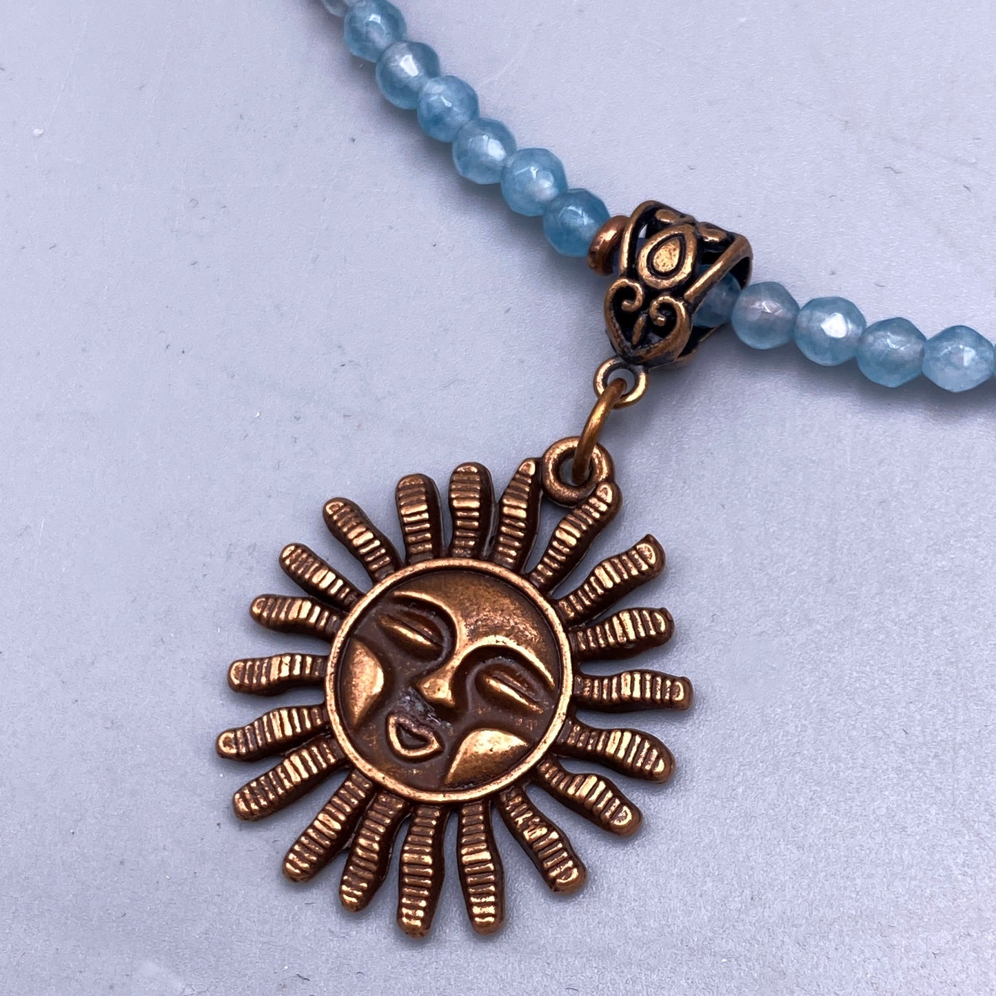 Aquamarine gemstone beaded necklace with Sun pendant