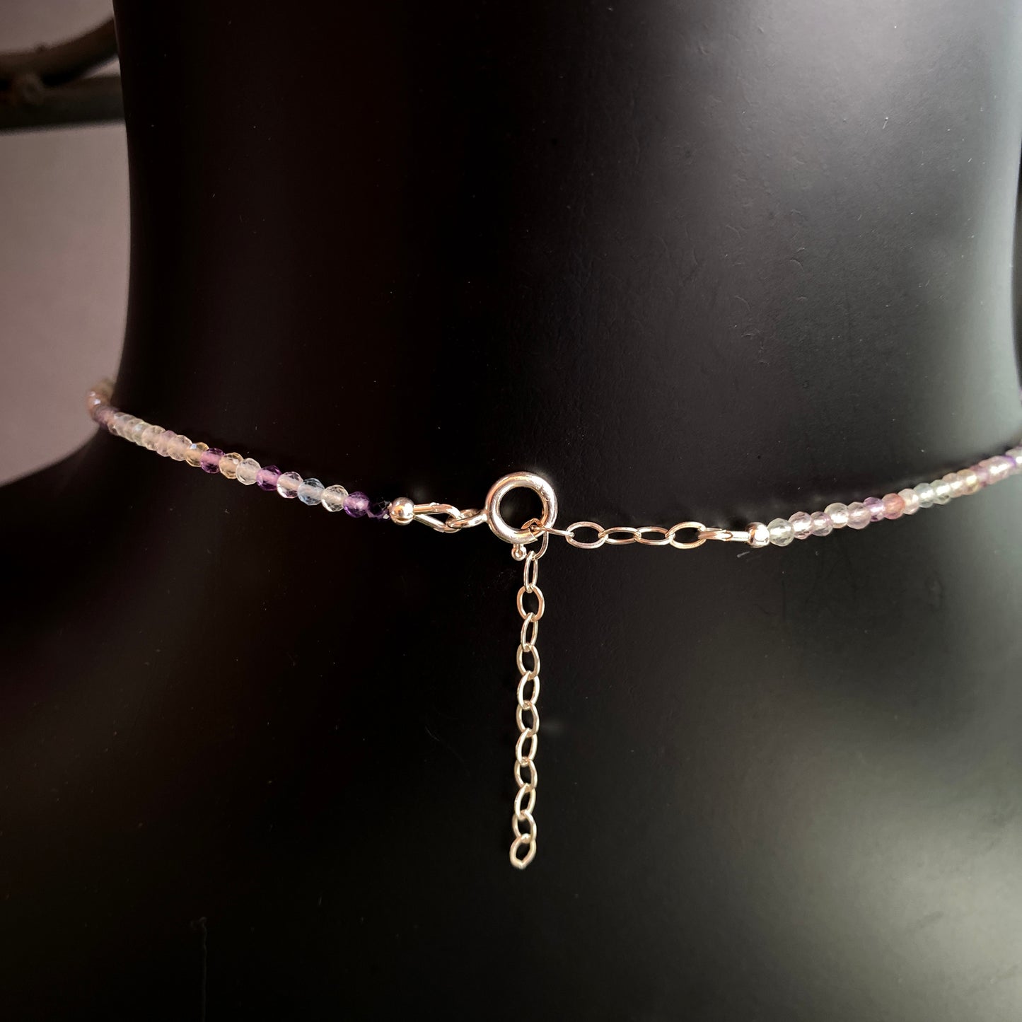 Mother of pearl mermaid on rainbow fluorite with Ethiopian opals, white topaz and sterling silver.