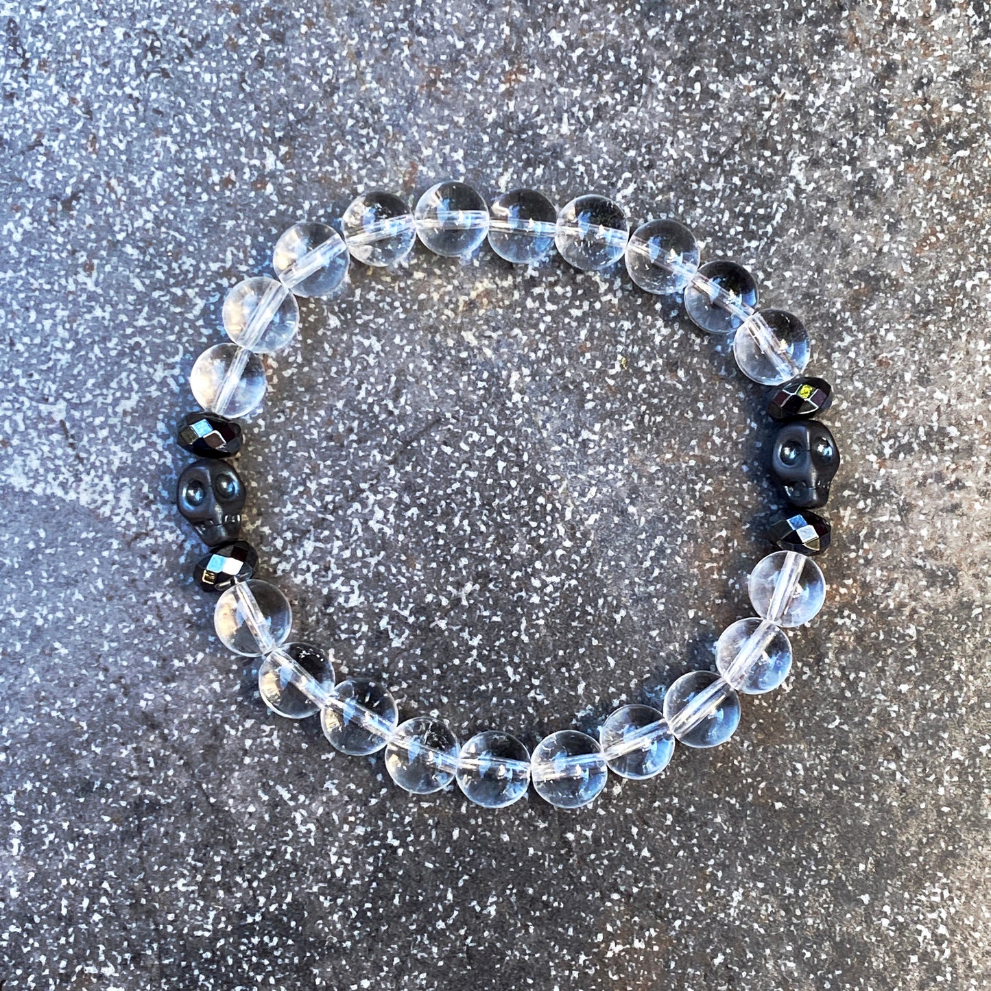Clear Quartz gemstone and Hematite Skull Men’s Stretch Bracelet