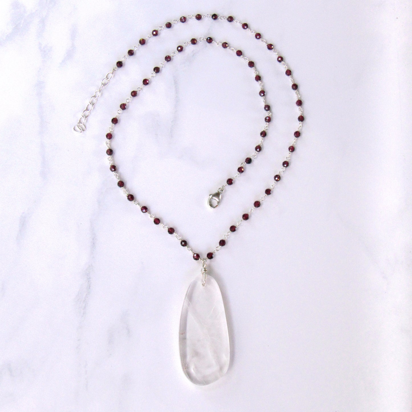 Clear Quartz Gemstone on Wrapped Garnets and Sterling Silver Necklace