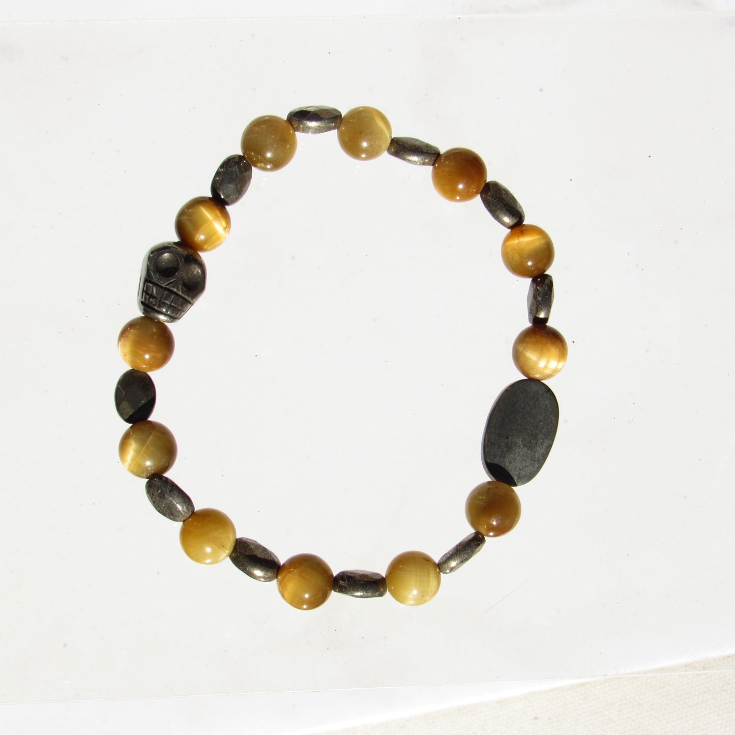 Tiger Eye gemstone and Pyrite skull beaded stretch bracelet