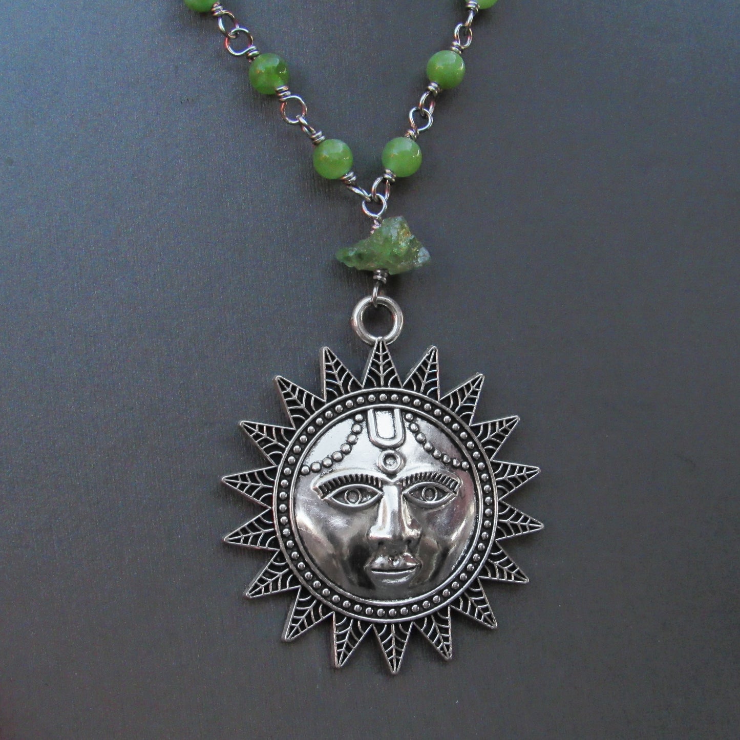 Peridot gemstone beaded necklace with Sun pendant