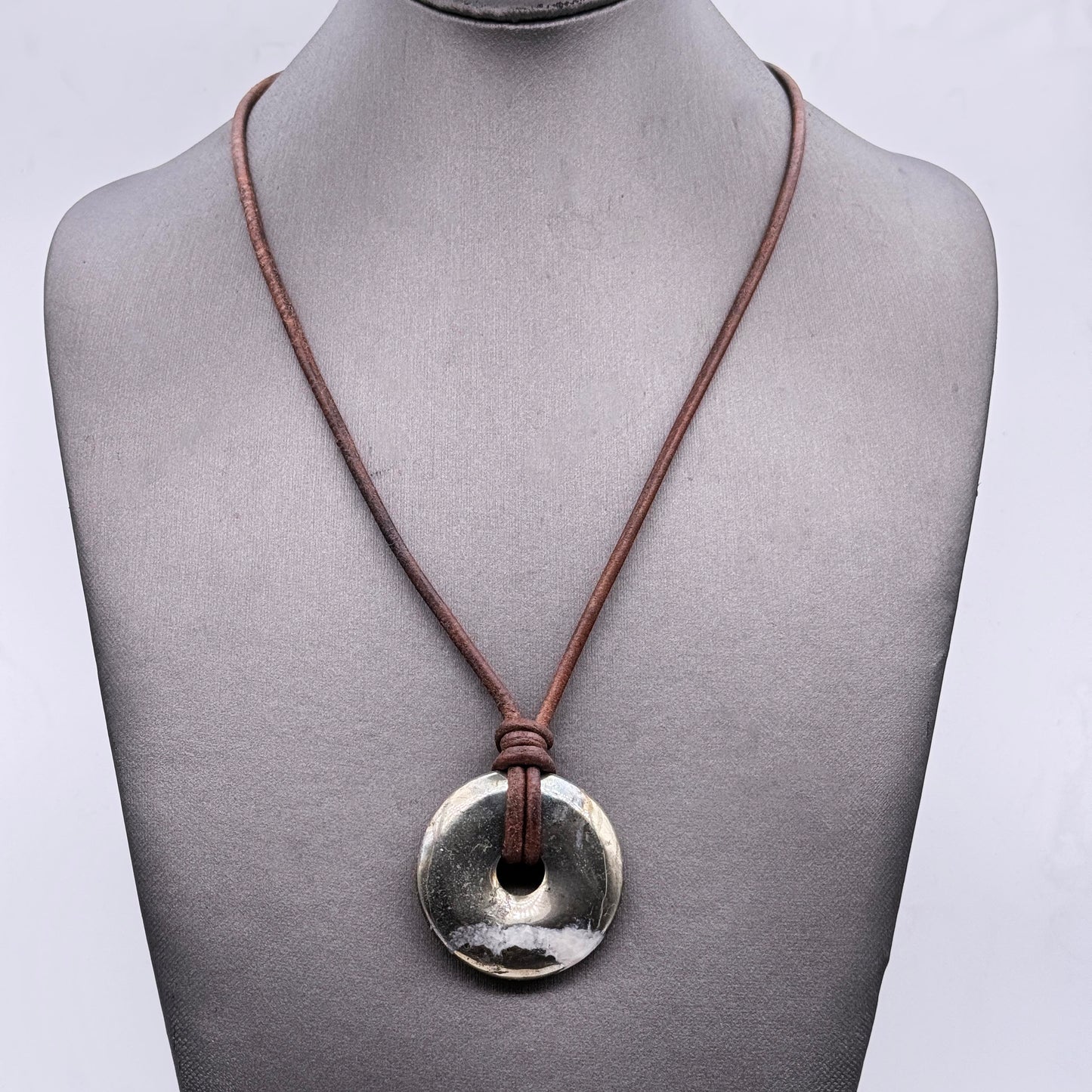 Pyrite donut necklace on leather