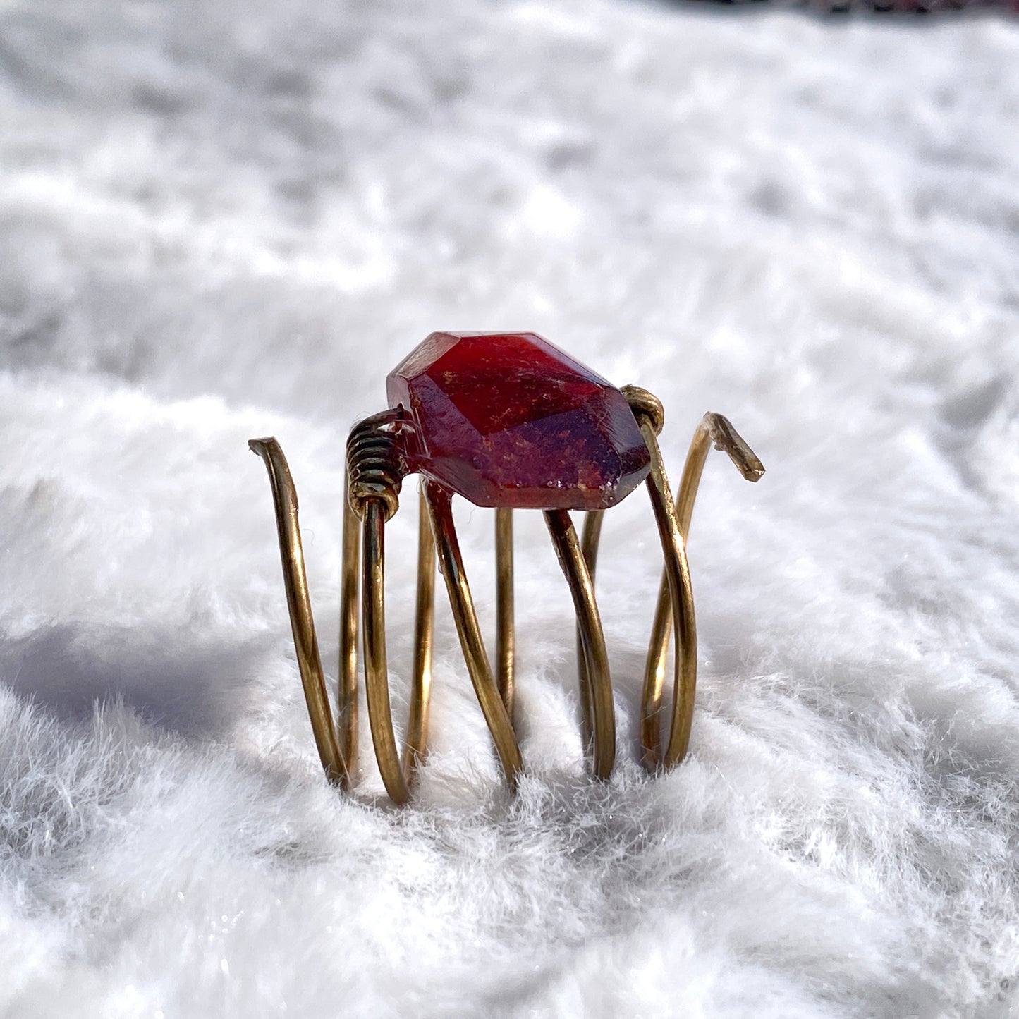 Hand hammered Brass wire ring with garnet birthstone