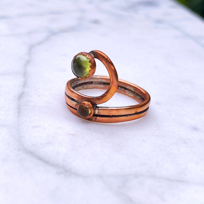 Handmade copper Ring with a Peridot gemstone.