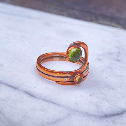 Handmade copper Ring with a Peridot gemstone.