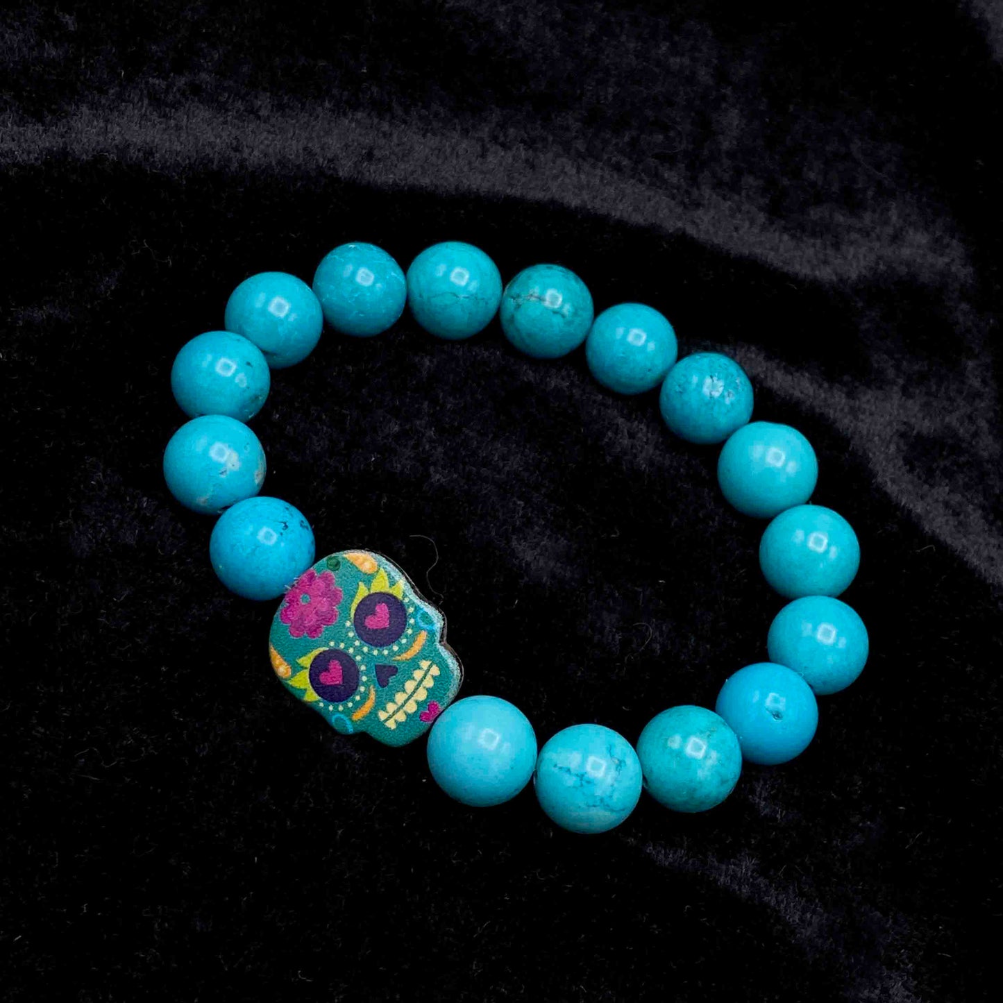 Metal Skull on gemstone beaded bracelet