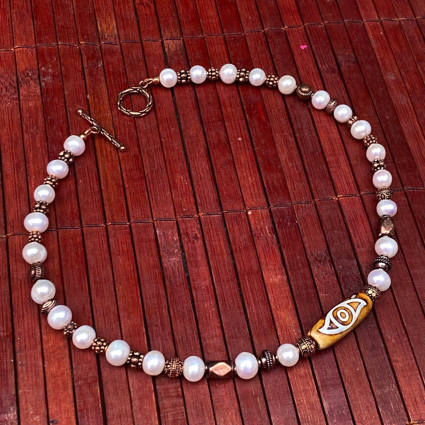 Pearl and Copper Evil Eye Necklace