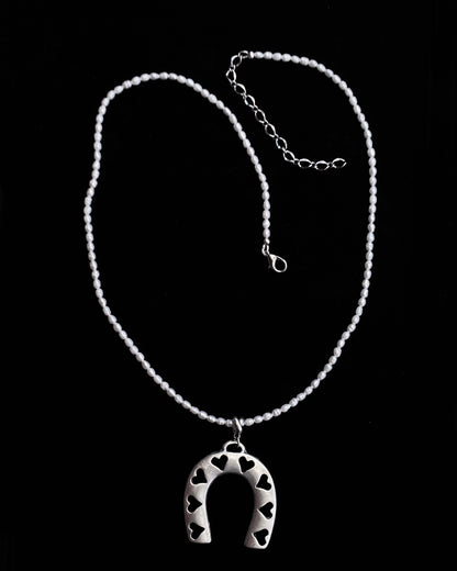 Pearl beaded necklace with silver plated Horseshoe pendant