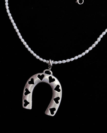 Pearl beaded necklace with silver plated Horseshoe pendant