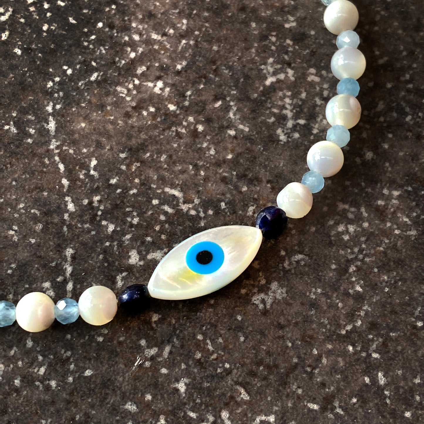 Women's mother of pearl, Blue Sapphire, and Aquamarine Evil Eye Gemstone silver Clasp Bracelet