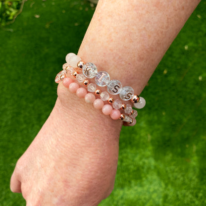 Women's KISS Gemstone bracelet stack set with Opals, Rose Quartz and Clear Quartz heart.