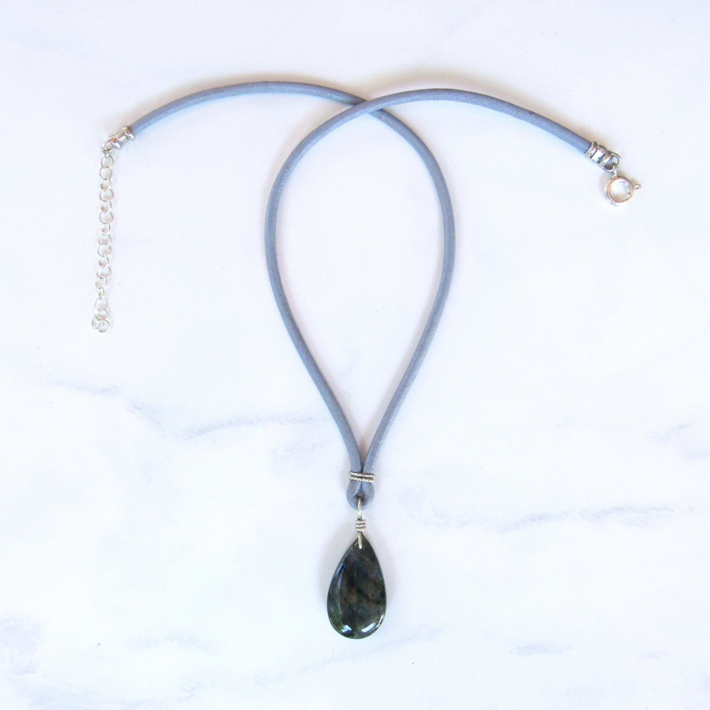 Blue Flame Labradorite gemstone Hand Wrapped on Leather W/ Sterling Silver