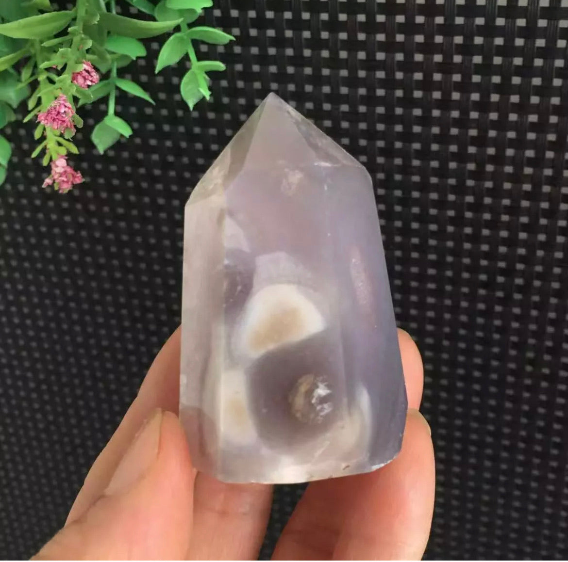 Amethyst geode inside purple agate tower