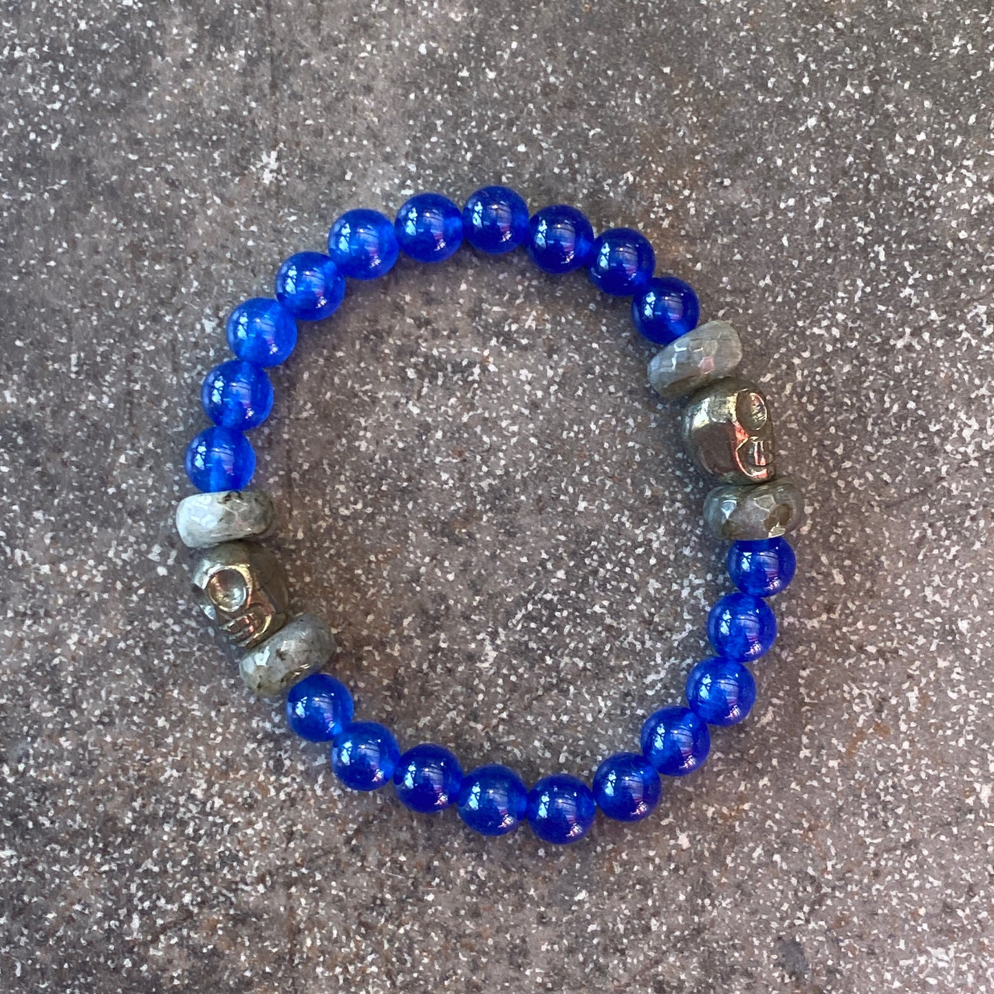 Men’s Blue onyx, pyrite skulls, and labradorite gemstone stretch bracelet