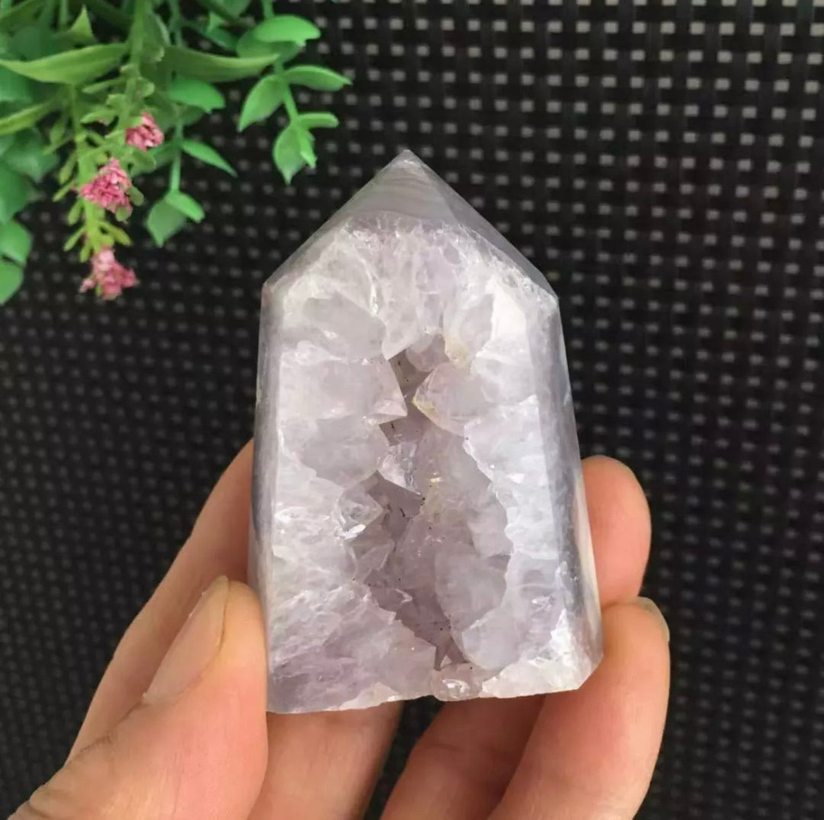 Amethyst geode inside purple agate tower