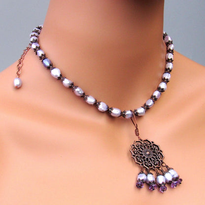 Purple freshwater pearls, amethyst gemstones, and copper chain and pendant design.