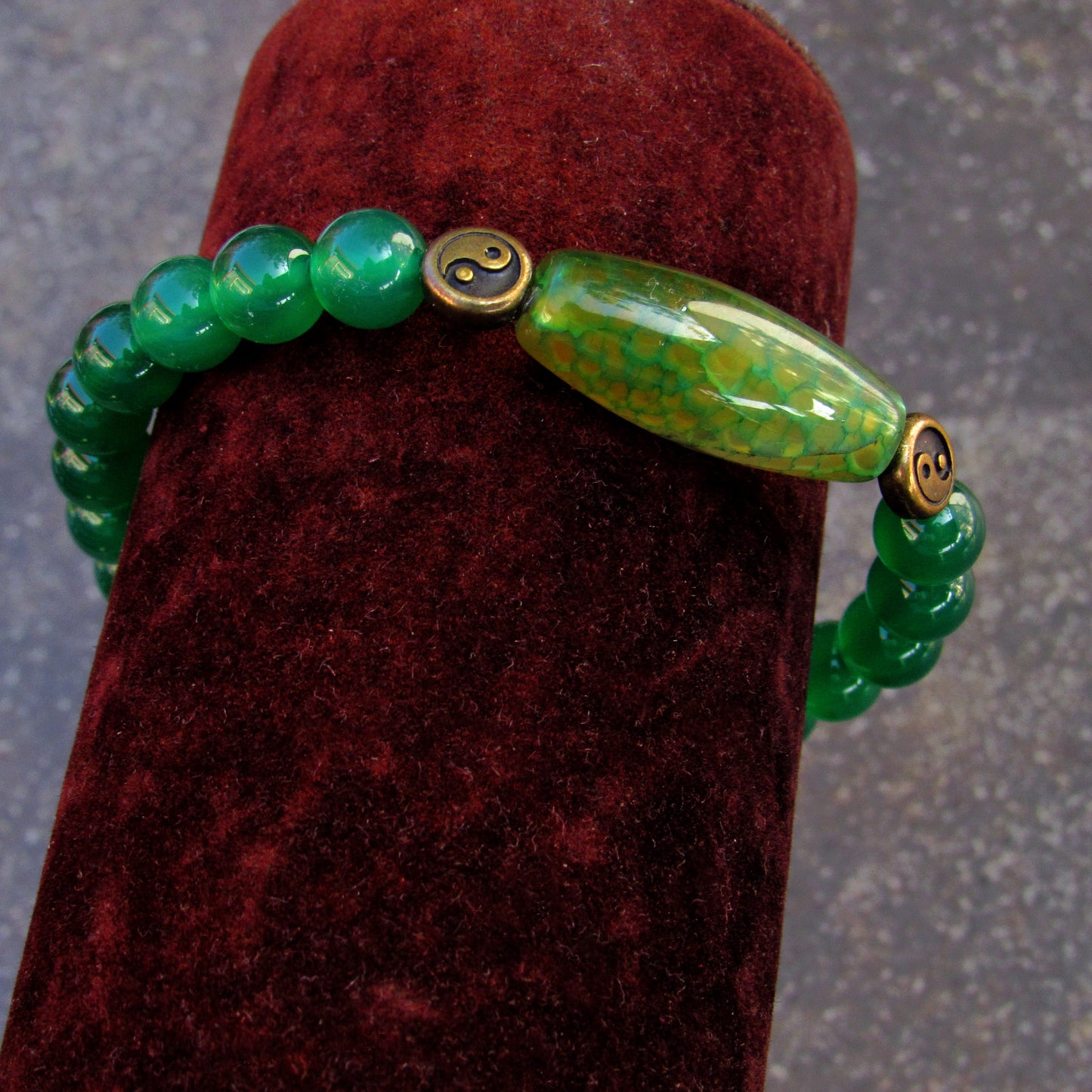 Green onyx gemstone, brass Yin Yang, and Dragon Vein Agate stretch bracelet