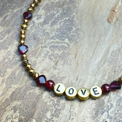 Garnet and hematite beaded gemstone “love” anklet with heart shaped garnets