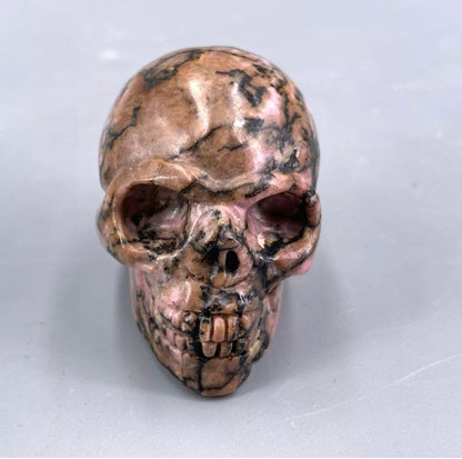 Natural Rhodonite gemstone Skull