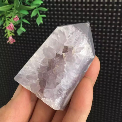 Amethyst geode inside purple agate tower