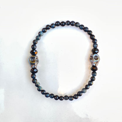 Blue Tiger Eye gemstones, Black Spinel, and Hematite Skull Women’s Stretch Bracelet