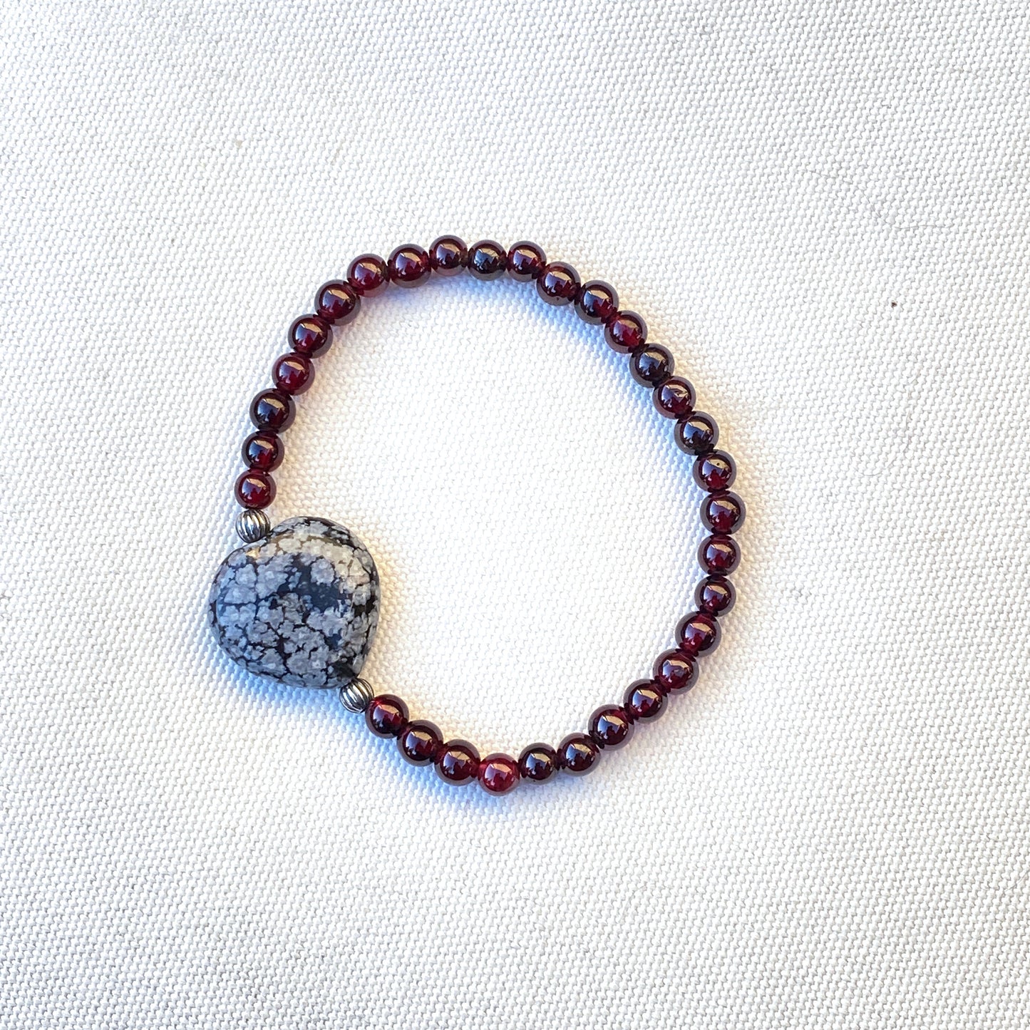 Garnet gemstones, Snowflake Obsidian Heart, and Sterling Silver Stretch Bracelet