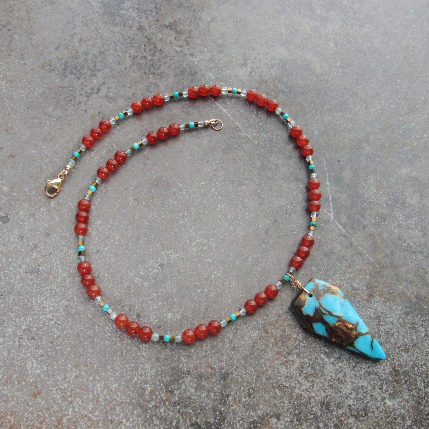 Bornite Gemstone pendant on carnelian, apatite, and hematite Beaded Necklace