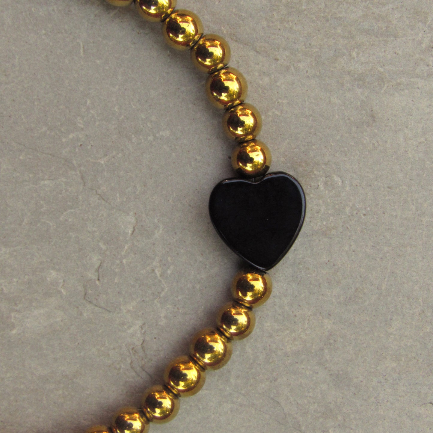 Gold Hematite and Onyx gemstone Heart "COURAGE" bracelet