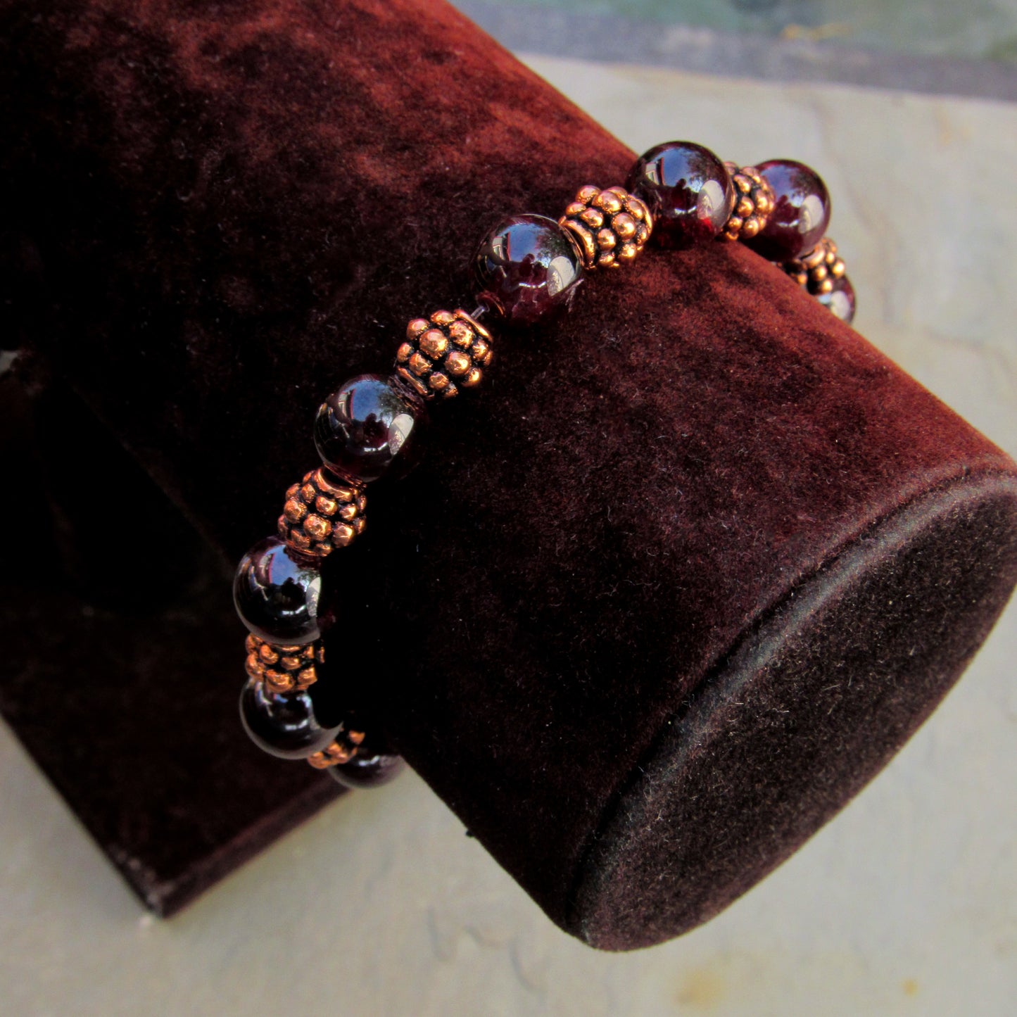 Garnet gemstones with copper stretch bracelet