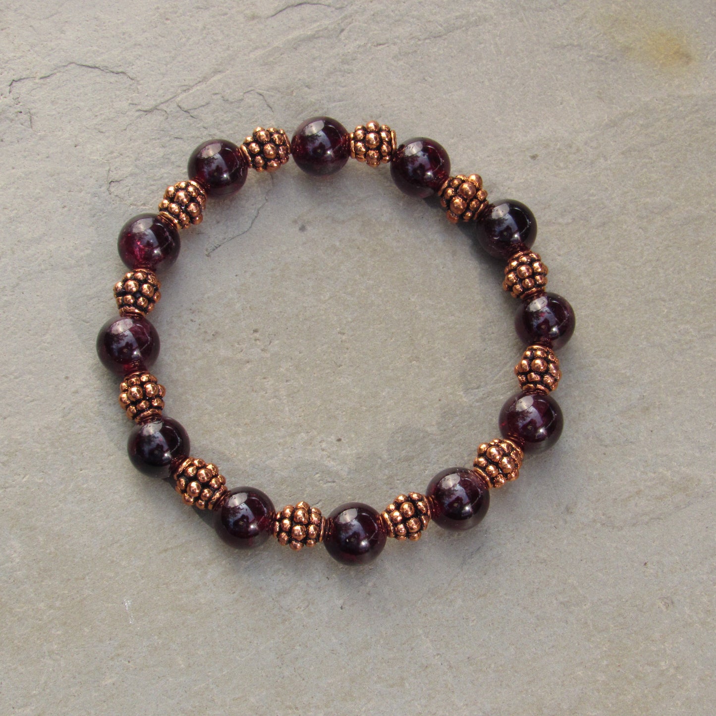 Garnet gemstones with copper stretch bracelet