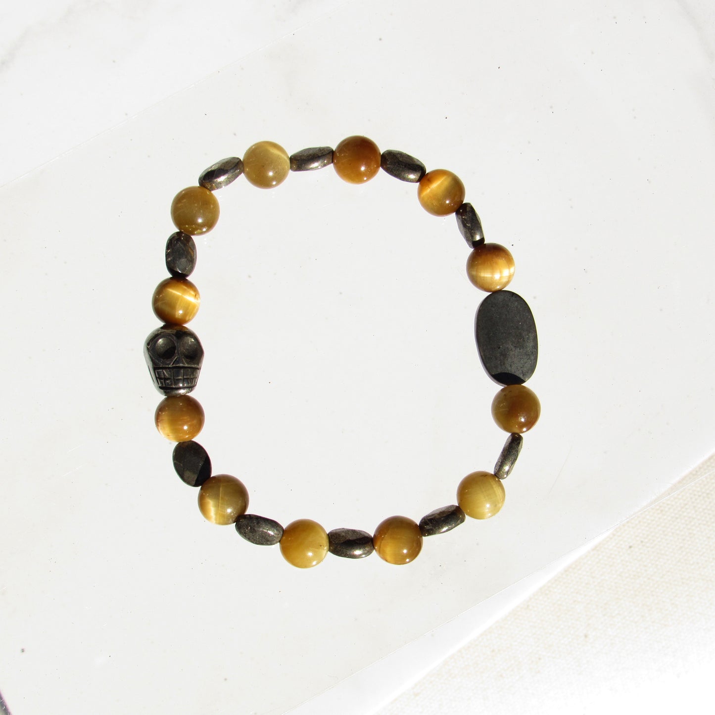 Tiger Eye gemstone and Pyrite skull beaded stretch bracelet